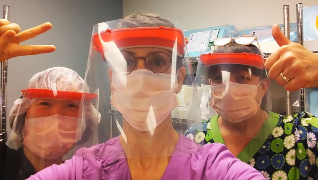 Medical professionals wearing 3D printed face shields